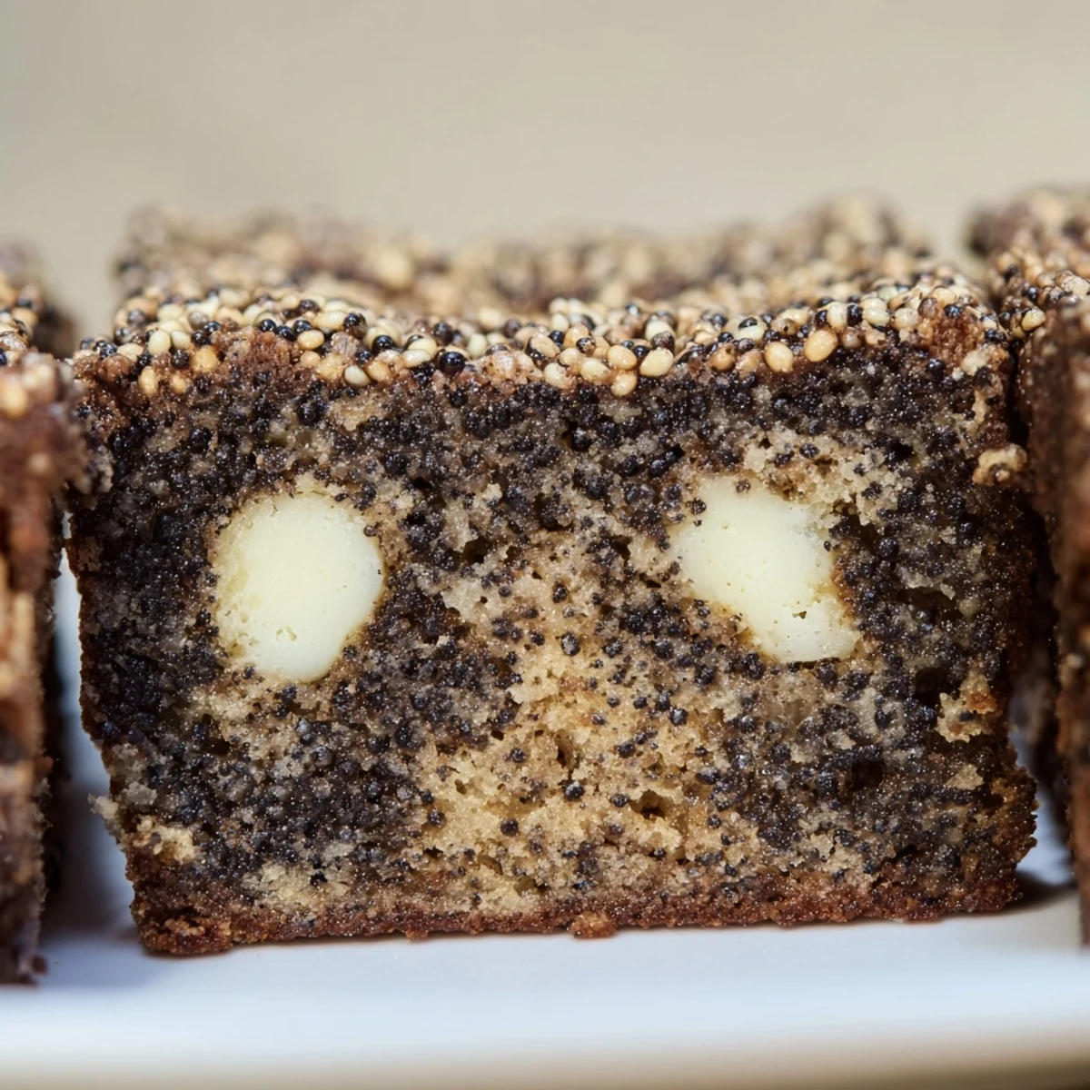 Rich black sesame blondies cut into squares revealing a moist, nutty crumb interior