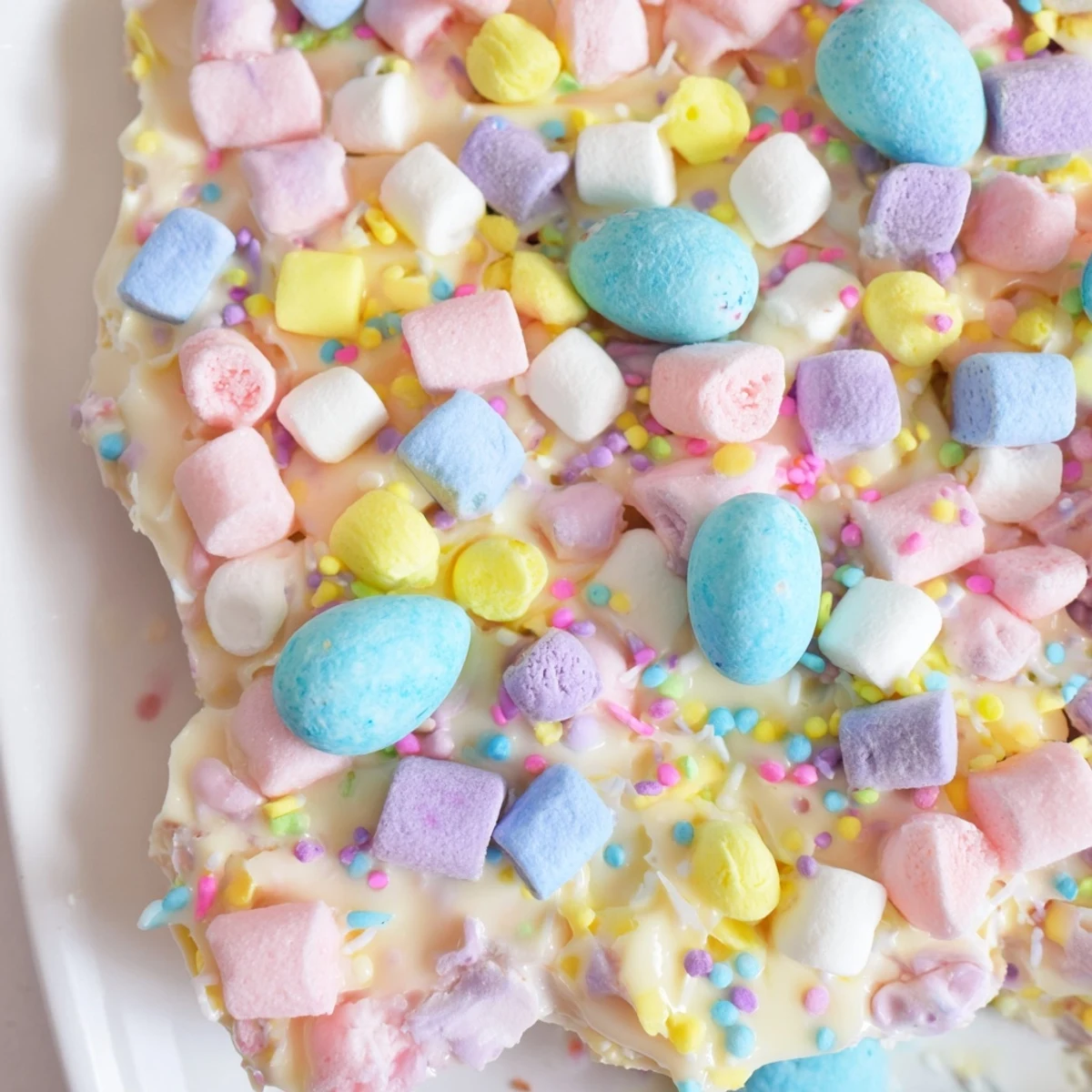 Homemade Easter marshmallow bark broken into pieces with crushed chocolate eggs on top