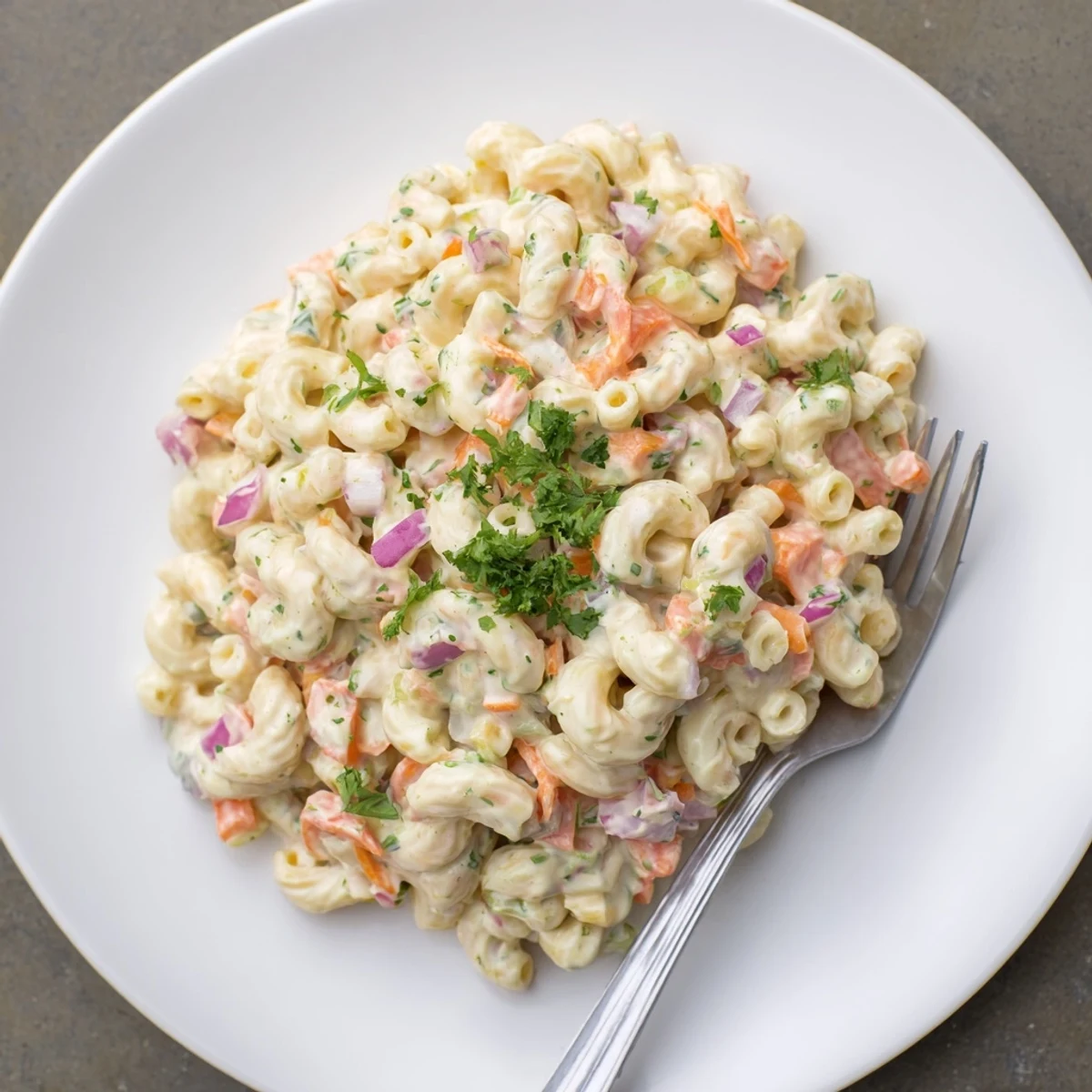 Creamy Tangy And Creamy Macaroni Salad dressed pasta with crunchy vegetables and fresh parsley