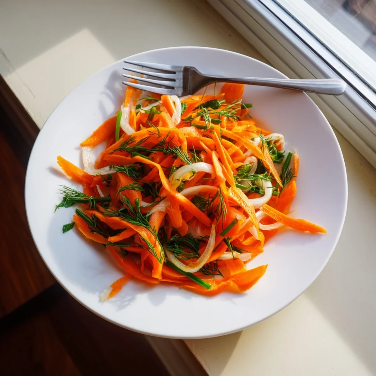Marinated Lemon Dill Carrot Salad glistening with citrus dressing and fresh green herbs