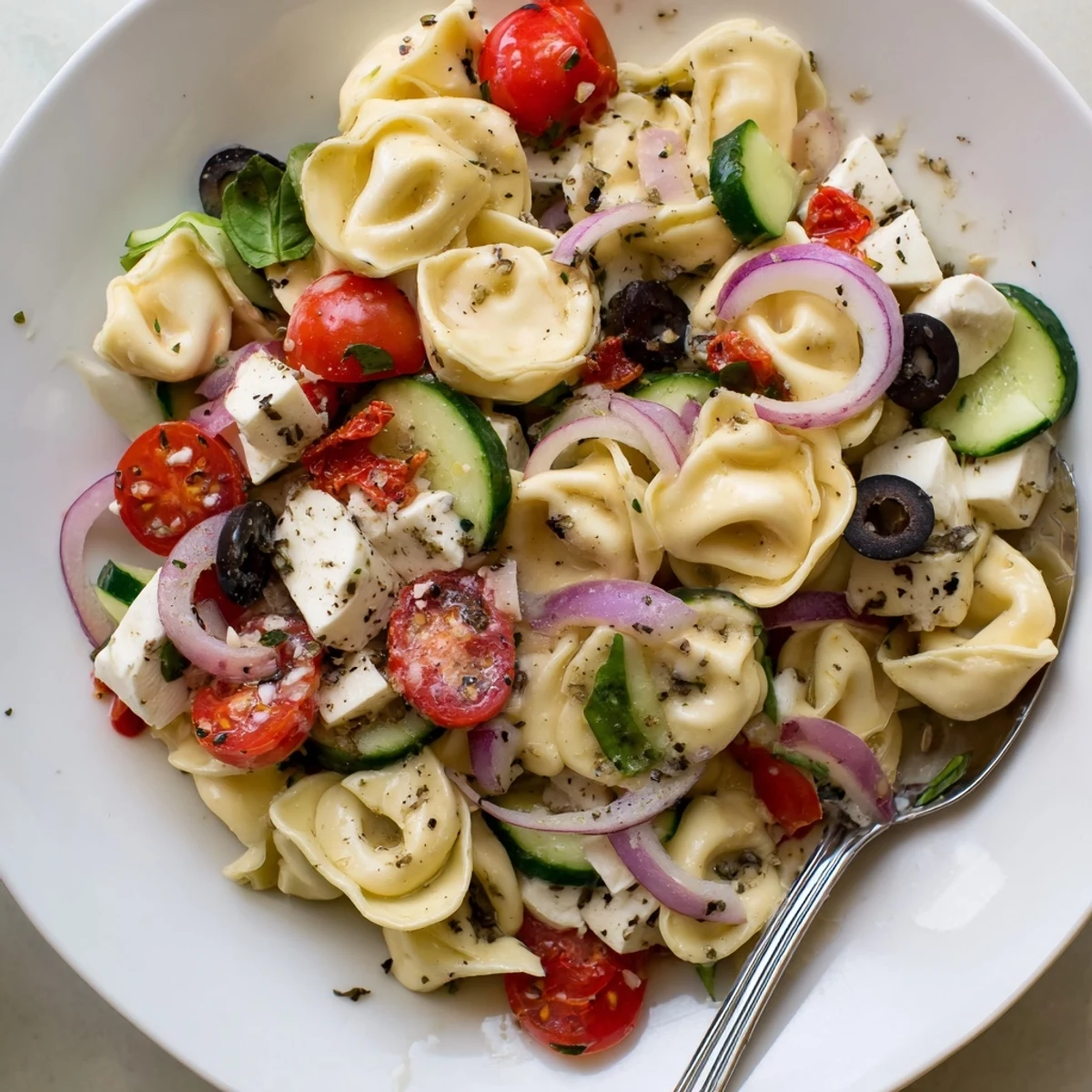 Creamy Tortellini Pasta Salad tossed in zesty Italian dressing, served cold