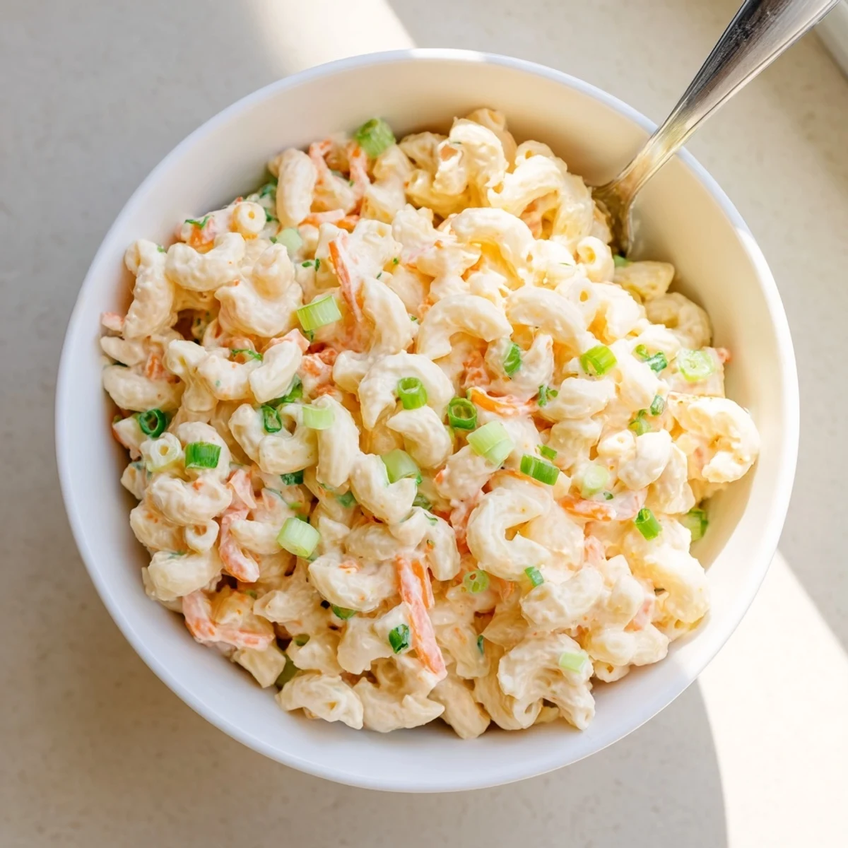 Classic Hawaiian plate lunch side dish with soft elbow macaroni and colorful chopped vegetables